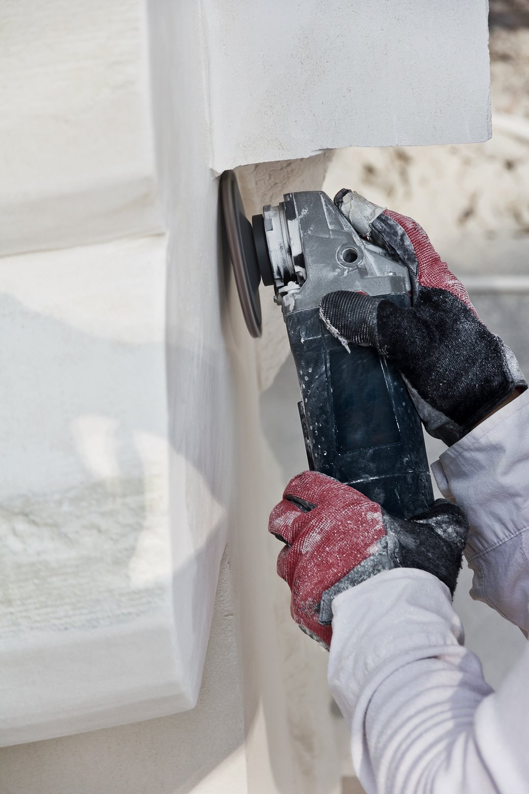 Worker polishing marble